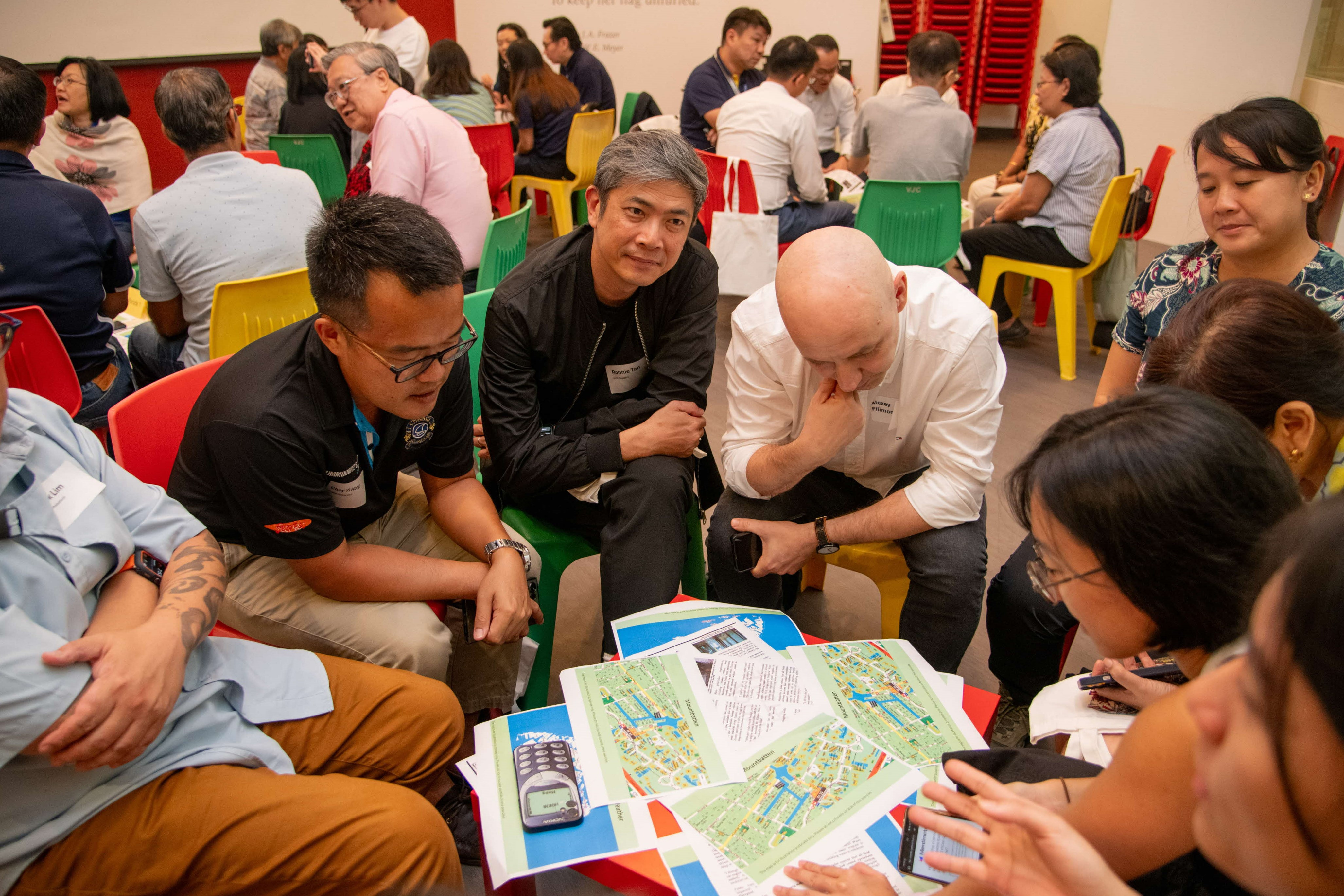 Participants discussing about flood preparedness at our inaugural table-top exercise on climate threats